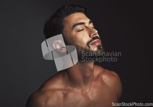 Image of Skincare, face and man with beauty, dermatology and detox for wellness, luxury and cosmetics on studio background. Male, guy or natural body care for grooming, treatment or routine for organic facial