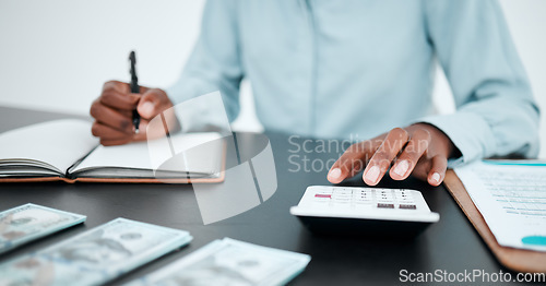 Image of Hand, calculator and writing with a finance accountant working on savings or investment in a work office. Money, accounting and budget with a bank employee at work for financial growth or planning