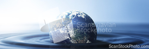 Image of Water, planet and climate change with the earth in a puddle as a symbol of global warming or temperature shift. Nature, abstract and background with the world in the sea or ocean for sustainability