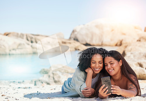 Image of Friends, phone selfie and relax beach travel together for summer holiday, vacation or quality time bonding. Women, smile and happiness for smartphone photography or ocean sea adventure in sunshine