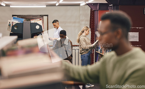 Image of Students, group and library research for books, studying and education at college for success. Diversity, book and shelf search at university for goals, learning and motivation with gen z student