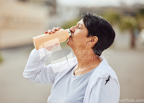 Image of Fitness, runner or old woman drinking water with sports goals resting or relaxing on break. Healthy, tired or thirsty elderly person drinks natural liquid in cardio workout, training or body exercise