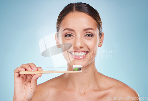 Image of Brushing teeth, dental and woman with toothbrush for teeth whitening and beauty, oral health and fresh breath with studio background. Mouth wellness, Invisalign portrait and clean with bamboo brush.