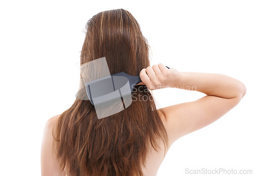 Image of Hair, brush and back of woman on a white background for wellness, keratin treatment and healthy hair. Beauty salon, hair products and girl brushing for shine, growth and hair care isolated in studio