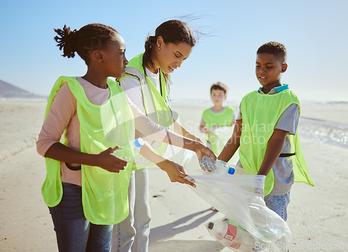 Image of Children, beach and plastic recycling teamwork for pollution ecology and environmental change collaboration. Eco friendly team, diversity and ocean garbage recycle together for community cleaning