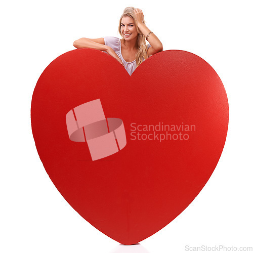 Image of Heart, love and studio portrait of woman with big red object, romantic product or emoji icon for Valentines Day holiday. Beauty, happy smile and relax model girl with care symbol on white background