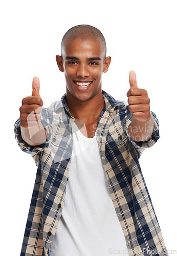 Image of Portrait, thumbs up and motivation with a black man in studio on a white background saying yes or thank you. Winner, face and success with a handsome young male posing for a deal or agreement
