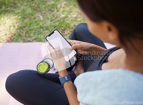 Image of Phone mockup, fitness and woman in nature for training with a mobile app, online workout and marketing exercise on social media. Space, advertising and athlete with a mobile for park sports in USA