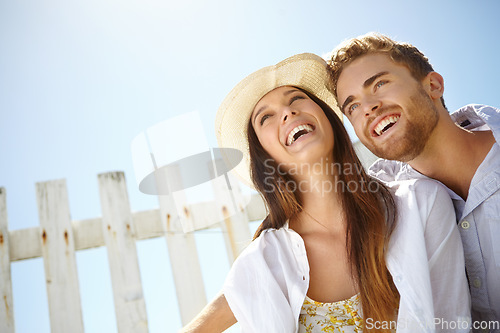 Image of Love, laugh and blue sky mockup with a couple on a date outdoor for romance or honeymoon travel. Space, summer and dating with a man and woman bonding together outside during holiday or vacation