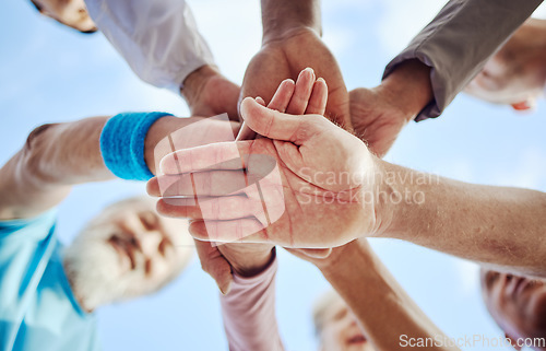 Image of Fitness, partnership or hands of senior friends with support, hope of faith in strategy, vision or mission for body goals. Low angle, healthy men and elderly people in team building or collaboration