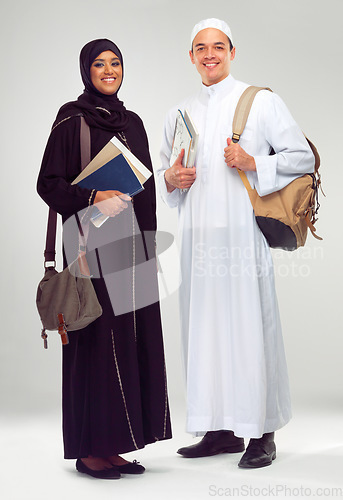 Image of Portrait, smile and Arabic students with education, knowledge and people isolated on white studio background. Islamic, man and woman in traditional clothes, learning or confident with books and smile