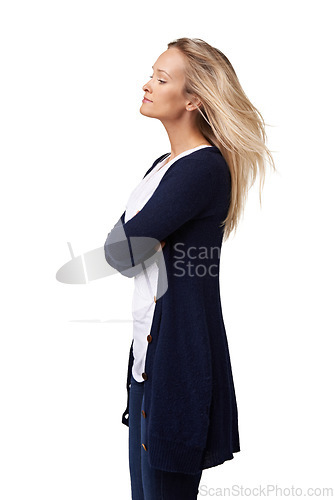 Image of Woman, studio and arms crossed in profile with hair, beauty and fashion by white background. Model, hair care and trendy clothes with arms folded, isolated and thinking for goals, vision or focus