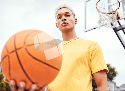 Image of Sports, basketball court and a portrait of man with ball outside at park. Exercise, motivation and workout for fitness, wellness and health. Street game, outdoor basketball training and serious face.