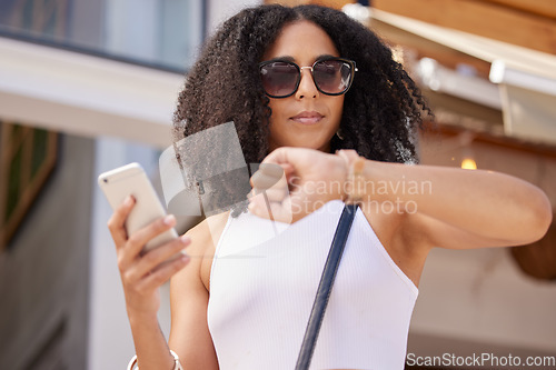 Image of Time, watch and smartphone of woman in city for summer shopping sale, discount or promotion marketing with online website. Black woman outdoor on cellphone waiting for promo on retail, ecommerce app