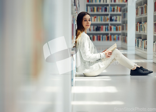 Image of Reading, education and portrait of a woman in a library for college research, learning information and book knowledge. Scholarship, happy and student at university studying law from books on campus