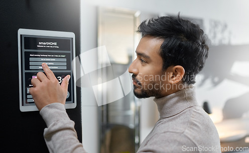 Image of Smart home wall system, technology and man with digital screen interface for room lighting, house automation or air conditioning. AI software app, control panel and profile of person with IOT monitor