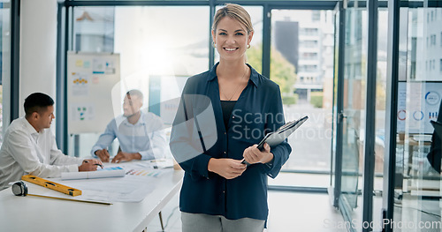 Image of Portrait, documents and building with a woman architect standing in her office boardroom at work. Architecture, design and mindset with a female builder holding a paperwork clipboard while working