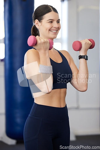 Image of Fitness, dumbbell weights and woman doing an exercise for arm strength, health and wellness in the gym. Sports, healthy and happy female athlete doing a muscle workout or training in a sport center.