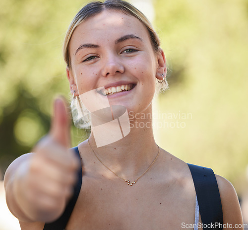 Image of Portrait, woman and thumbs up in nature while outdoor for freedom, happiness and support for summer travel adventure. Happy young female with hand sign and backpack for motivation, peace and wellness