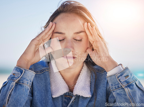 Image of Thinking woman, stress face or anxiety by beach, ocean environment or sea nature in healthcare wellness meditation. Mental health, mind burnout or depression person with psychology crisis or headache