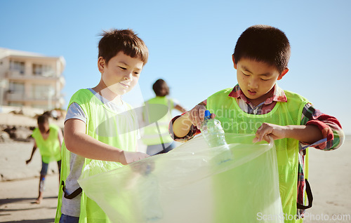 Image of Recycling, plastic and asian children at beach cleaning for education, learning and community help in climate change project, ngo and charity. Seoul friends with waste, garbage or trash for earth day