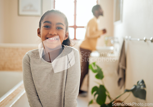 Image of Family, wellness and portrait of girl in bathroom with dad for morning routine, hygiene and cleaning. Black family, smile and face of young child for grooming, healthy lifestyle and self care at home