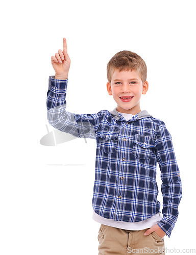 Image of Kid, portrait and hand pointing to idea space with optimistic, friendly and happy smile for advertising. Happiness, cute and young child presenting mock up for marketing on isolated white background.