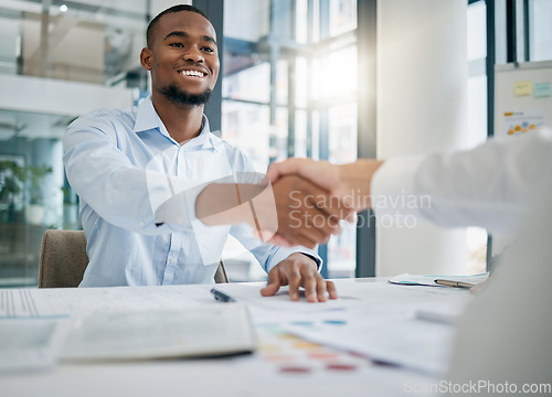 Image of Hiring, designer or black man shaking hands with human resources manager for a successful job interview in office. Handshake, meeting or worker with a happy smile for a job promotion or business deal