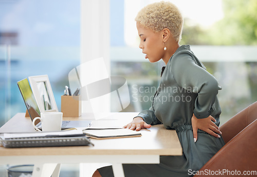 Image of Business, black woman and back pain in office, muscle injury and burnout. Startup, African American female and administrator frustrated, stress and muscle backache in workplace and posture problem