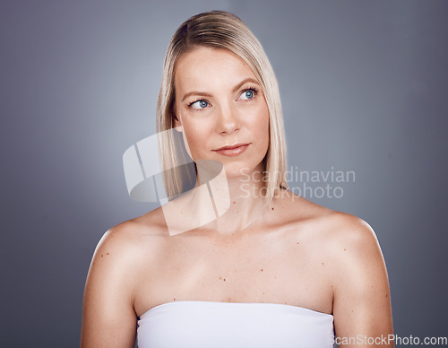Image of Skincare, beauty and face of woman in studio for wellness, body care and beauty products on gray background. Dermatology, luxury spa and girl marketing facial treatment, healthy skin and cosmetics