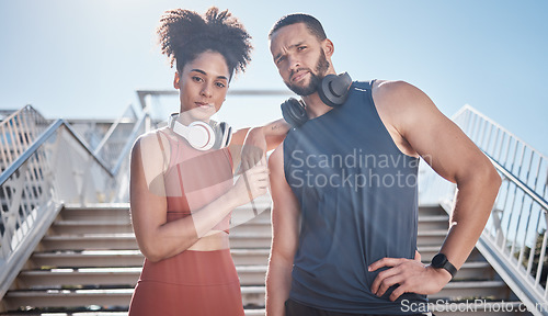 Image of Black couple, city stairs portrait and fitness with headphones, music and motivation at outdoor workout. Exercise couple, teamwork and support for health, urban training and development of wellness