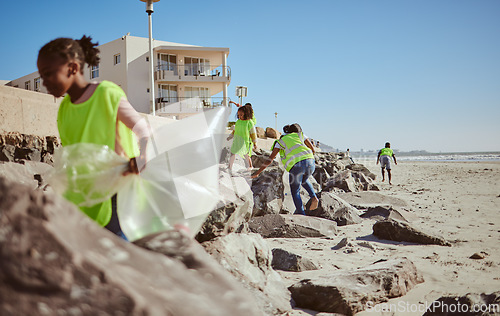 Image of Beach cleaning, plastic and children volunteer for education, learning and community help in climate change project, ngo and charity. Friends or students with waste, garbage or trash for earth day