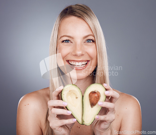 Image of Skincare, beauty and portrait of woman with avocado in studio for wellness, vitamins and luxury spa. Dermatology, makeup and girl marketing organic, healthy and natural cosmetics for facial treatment