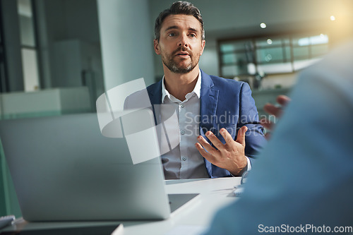 Image of Laptop, meeting and interview with a business man talking to a candidate for the hiring or recruitment process. Computer, feedback or review with a male employee sitting in a human resources office