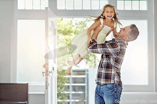 Image of Happy, love and father carrying a girl in their modern family home for fun, care and happiness. Smile, bonding and mature man playing with his excited child daughter in their house in Australia.