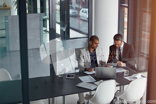 Image of Business people, talking and planning online for corporate strategy or partnership with teamwork. Men together in a meeting discussion with documents, paperwork and laptop at management table