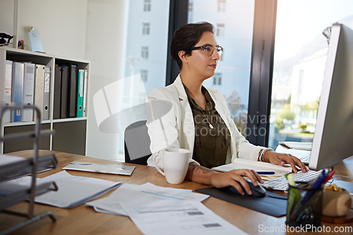 Image of Computer, working and business woman in office typing online documents, website research and writing email. Corporate networking, and busy female employee at desk with focus, planning and ideas