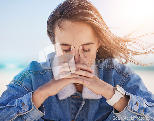 Image of Woman, beach and stress headache for anxiety, depression or mental health pain. Young tired girl, thinking burnout and depressed head pain, overwhelmed fear or frustrated migrain by ocean sea outdoor