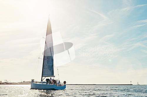 Image of Sea, yacht and sailing on the ocean on vacation by summer sunshine on water. Lens flare, holiday adventure and boat cruise travel of people in the sun and blue sky in nature to relax with mockup