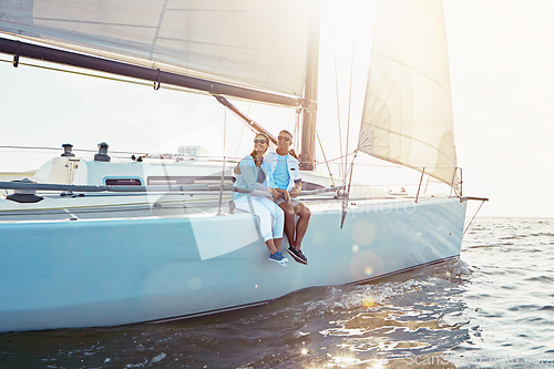 Image of Happy couple, boat and cruise on ocean in summer sunshine, love and romance on outdoor adventure. Couple, yacht and sea with waves, bonding and peace with luxury, lifestyle and travel for vacation