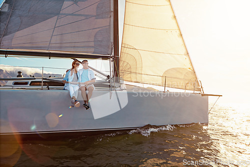 Image of Yacht, sea and love with a mature couple sailing together on water for holiday, vacation or romance. Boat, ocean and date with a senior man and woman bonding while enjoying a trip on the water