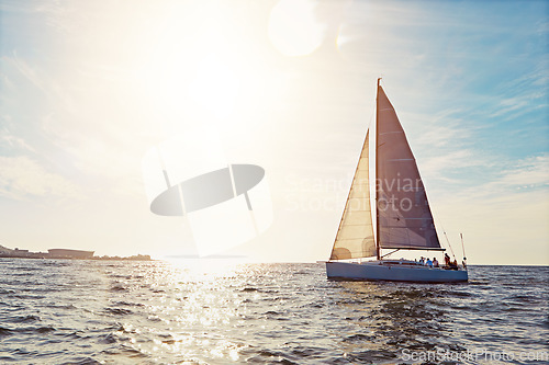 Image of Mockup, sunset and a yacht at sea for travel, tourism or a luxury summer vacation outdoor. Blue sky, water and wave with a boat on the ocean in nature for an adventure, holiday or getaway with flare