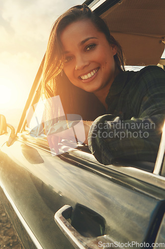 Image of Portrait, driver and road trip with a black woman in a car at sunset during summer vacation or travel. Nature, window and drive with an attractive young female sitting in transport for adventure