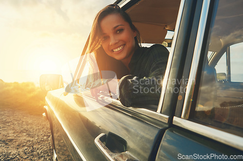 Image of Portrait, travel and road trip with a black woman in a car at sunset during summer vacation or holiday. Nature, window and drive with an attractive young female sitting in transport for adventure