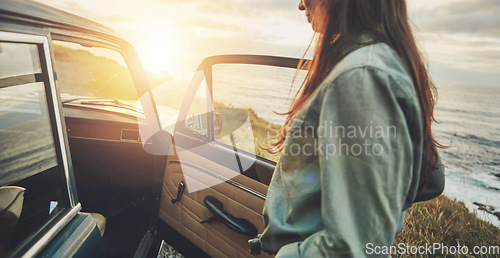 Image of Vintage car, sunset and woman by ocean for road trip, travel and summer vacation for journey, adventure and freedom. Young, gen z driver by sea, ocean or lake for retro lifestyle with transportation