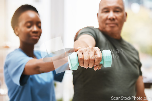 Image of Medical, training and physiotherapy with dumbbell and old man with nurse for rehabilitation, support and retirement. Healthcare, help and physical therapy with patient and black woman in nursing home