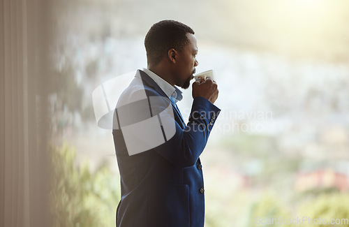 Image of Thinking businessman, travel or drinking coffee by window in airport lounge, hotel lobby or modern office building. Corporate worker, employee or manager with tea, innovation vision or company ideas