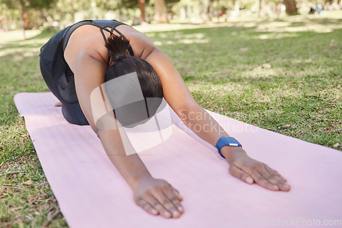 Image of Black woman, stretching or nature park yoga on mat in for zen healthcare wellness, relax exercise or workout peace training. Childs pose, fitness yogi or person on garden grass in back muscle pilates