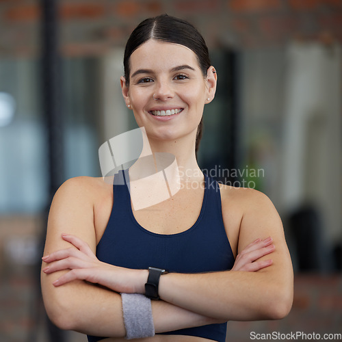 Image of Woman in gym, portrait and exercise with smile for fitness, health and cardio with active lifestyle, happy and strong. Focus, wellness and sport motivation with young female athlete and body training