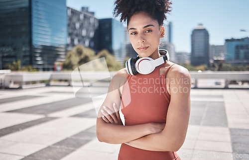 Image of Music, fitness and black woman in a city portrait for workout, exercise or training motivation, mental health and wellness Face of a sports athlete with headphones technology for audio subscription